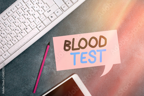 Handwriting text writing Blood Test. Conceptual photo Extracted blood sample from an organism to perfom a laboratory analysis Paper accesories with digital smartphone arranged on different background photo