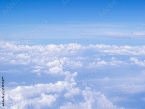 Fototapeta Naklejka Na Ścianę i Meble -  Aerial view of cloudscape seen through airplane window
