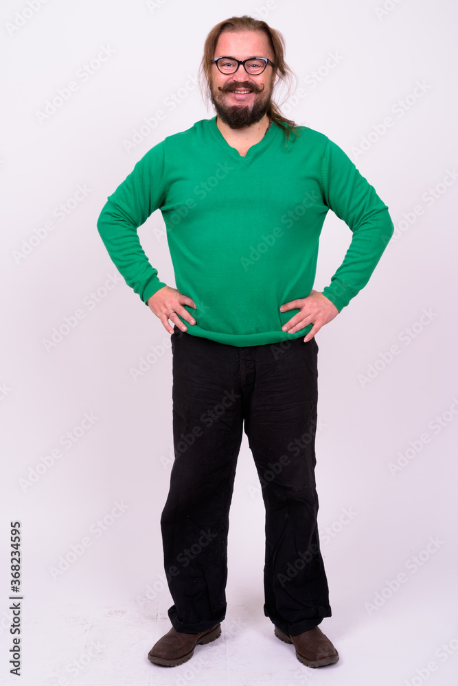 Portrait of happy bearded man with mustache and long hair Portrait of happy bearded man with mustache and long hair