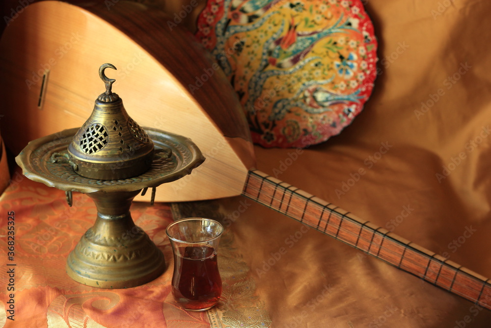 Turkish national musical instrument baglama saz, incense burner in the  Ottoman Muslim style and a traditional handmade plate Stock Photo