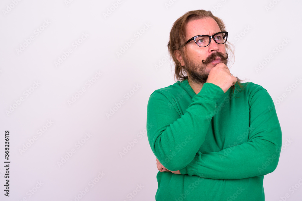 Bearded man with mustache and long hair against white background Bearded man with mustache and long hair against white background