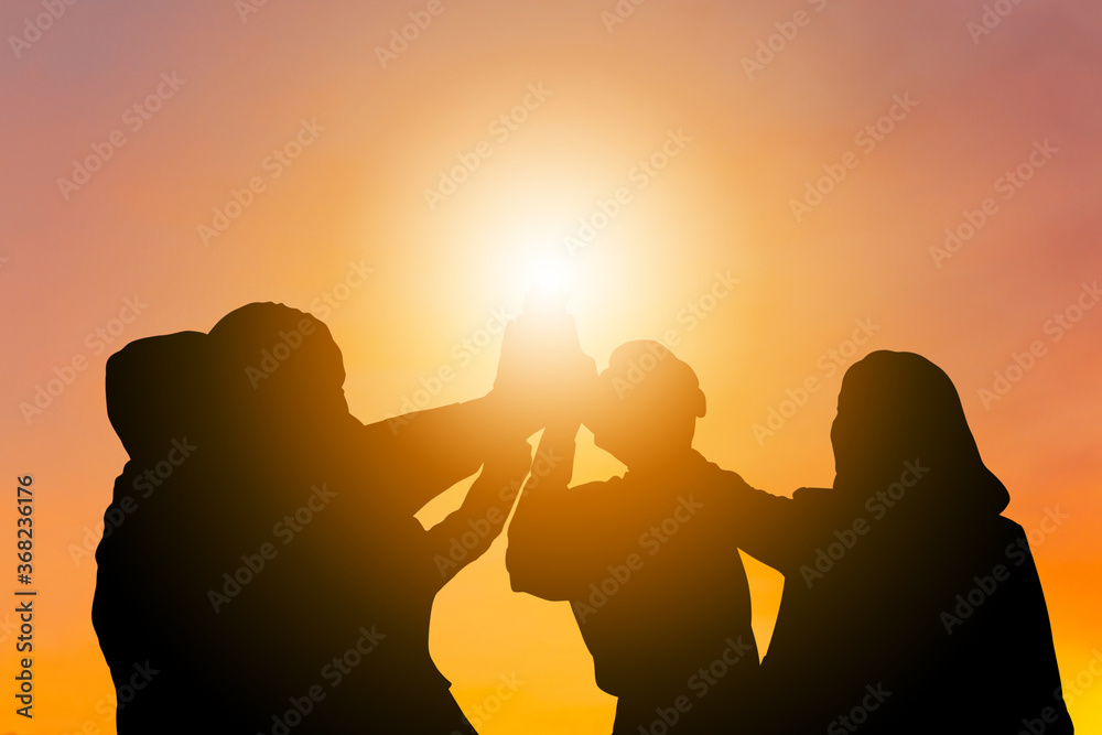 Silhouette of Business group celebrating after meeting, Business people team with clipping joining hands together with joy and success