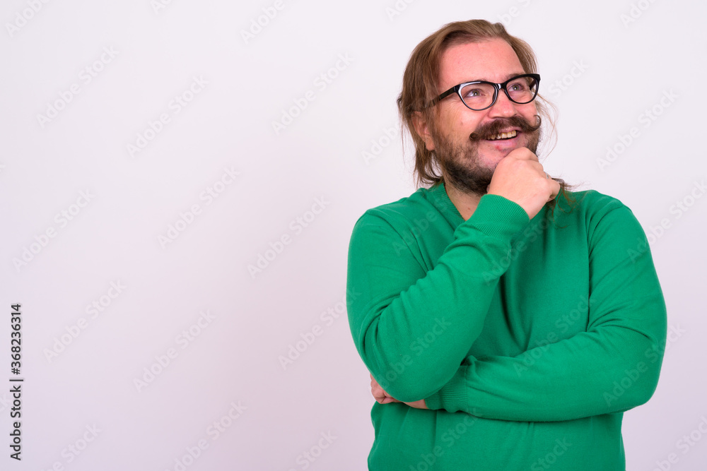 Portrait of happy bearded man with mustache and long hair Portrait of happy bearded man with mustache and long hair