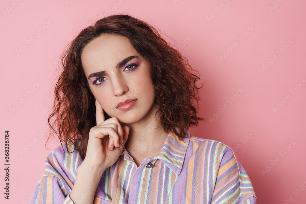 Image of redhead serious woman posing and looking at camera Image of redhead serious woman posing and looking at camera
