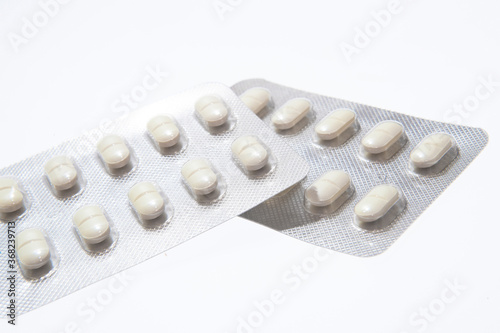 White pills in pack isolated on the white background. Disease treatment. The fight against coronavirus 2020