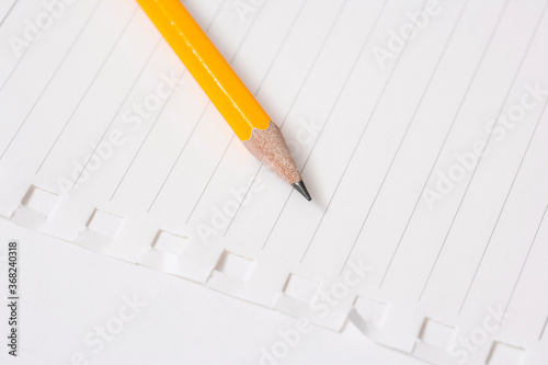 pencil and notebook on white background
