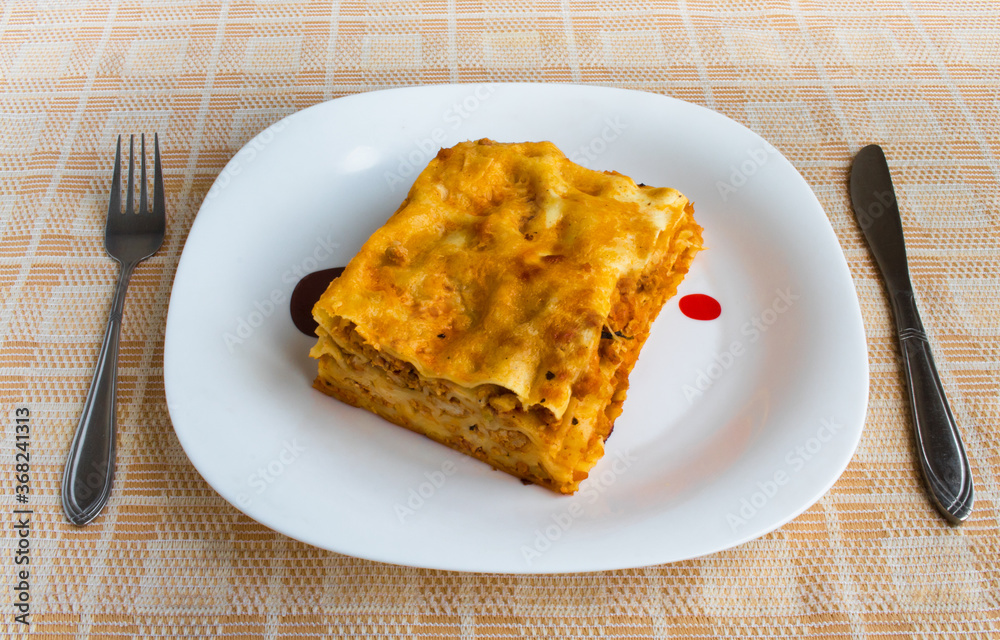 Lasagna on a white plate