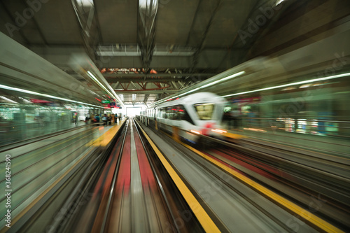 Abstract motion blur photo of subway road, monorail, train station