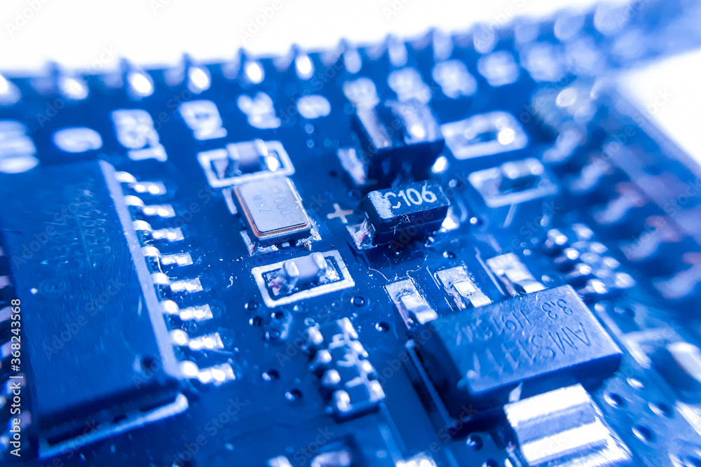 Blue abstract electronic circuit component. Blue engineering or technology background. Blue abstract electronic circuit component. Blue engineering or technology background.