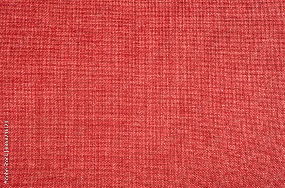 Fototapeta premium New red woven fabric close up