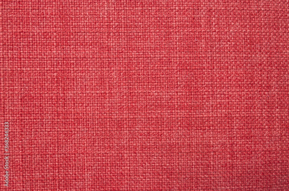 Fototapeta premium New red woven fabric close up