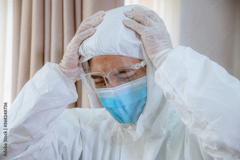 A Professional doctor team wearing safety uniform and medical mask to protect from coronavirus situation in hospital for treatment and take care patient .
