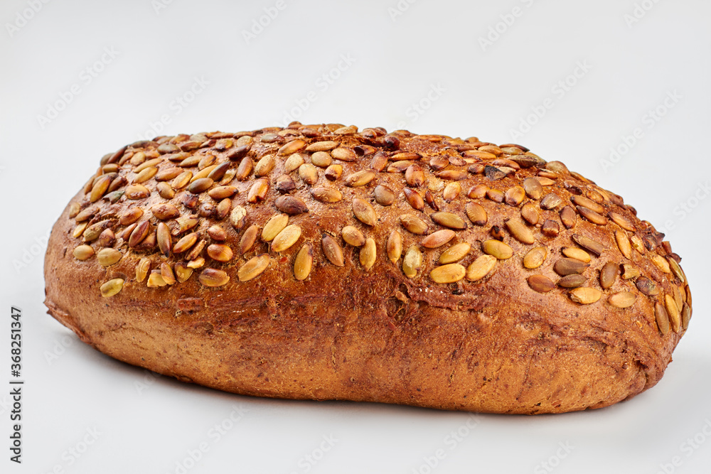 Organic grain wholemeal sourdough bread. Artisan organic wholemeal bread loaf. Isolated on white background. Organic grain wholemeal sourdough bread. Artisan organic wholemeal bread loaf. Isolated on white background.