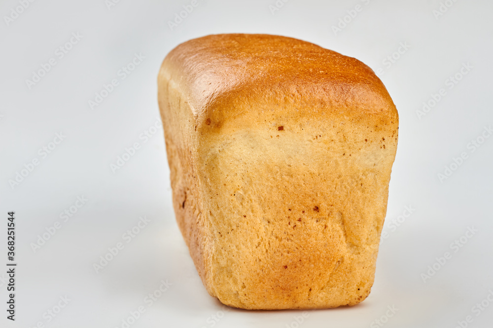Loaf of bread on white background. Square long loaf of bread. Space for text. Loaf of bread on white background. Square long loaf of bread. Space for text.