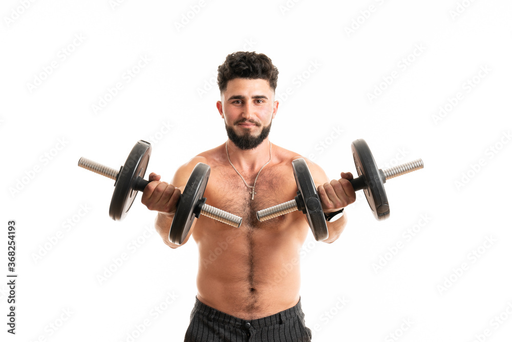 Handsome power man fitness-model with six packs is training with dumbbells, isolated on white background with copyspace Handsome power man fitness-model with six packs is training with dumbbells, isolated on white background with copyspace