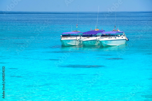 Boats for transporting tourists in the sea.Summer sea travel.Summer beach travel. © oneSHUTTER oneMEMORY