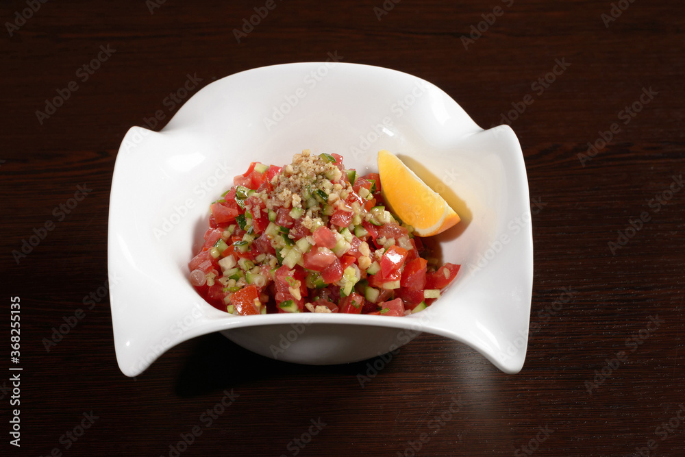 Healthy salad for a healthy diet from tomatoes, cucumbers with olive oil and walnuts. Photos for restaurant and cafe menus Healthy salad for a healthy diet from tomatoes, cucumbers with olive oil and walnuts. Photos for restaurant and cafe menus
