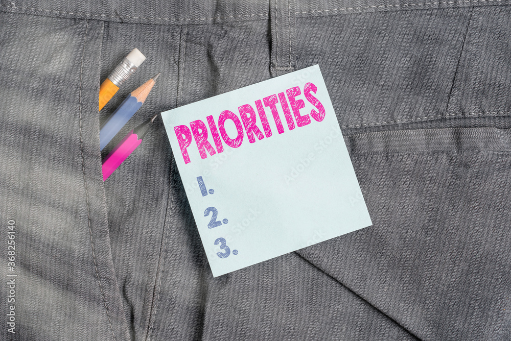 Handwriting text Priorities. Conceptual photo fact or condition of being regarded or treated as more important Writing equipment and blue note paper inside pocket of man work trousers Handwriting text Priorities. Conceptual photo fact or condition of being regarded or treated as more important Writing equipment and blue note paper inside pocket of man work trousers