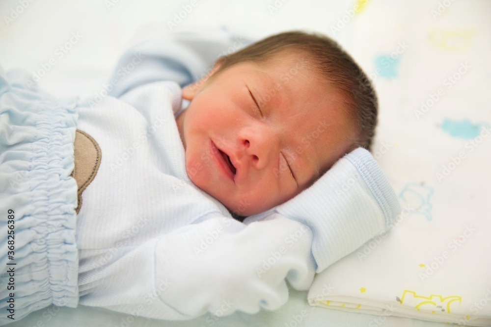 Cute baby asian boy sleeping.