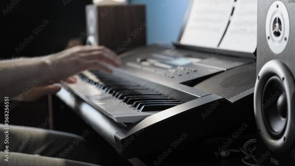 hands of a pianist playing a song in the studio on a synthesizer hands of a pianist playing a song in the studio on a synthesizer
