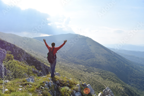 Man hiking in the mountains on a summer day. Adventurous Person enjoy high in the mountain. Dry Mountain, Serbia in summer
