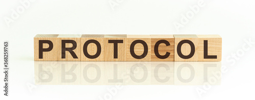 protocol word made with building blocks on a light background photo