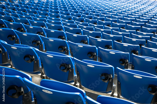 Football stadium with empty blue seats
