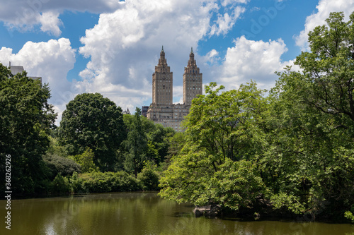 Central Park Lake with Green Trees during Summer with a view of the Upper West Side in New York City