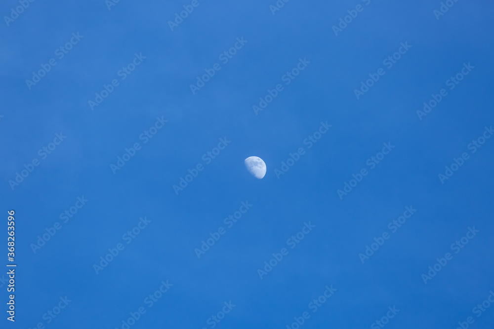 half moon during daylight background half moon during daylight background