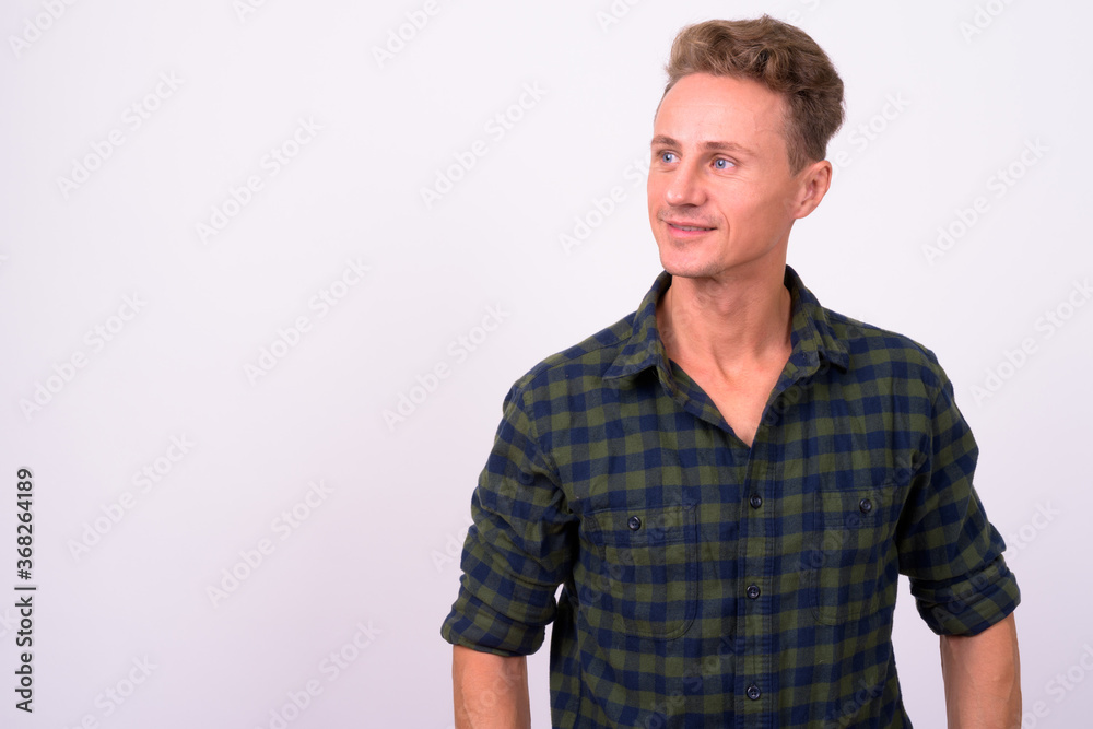 Portrait of happy handsome man with blond curly hair