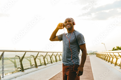 African american athlete man listening to the music