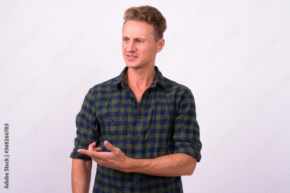 Handsome man with blond curly hair against white background Handsome man with blond curly hair against white background