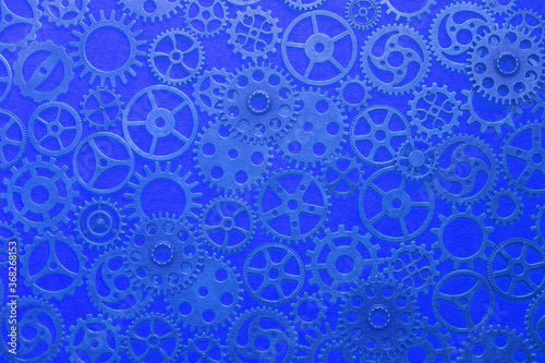 Gears, abstract background, lots of little gears with a blue tinge, steampunk.