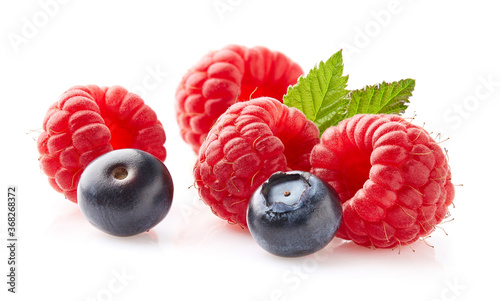Raspberry and blueberry in closeup on white background