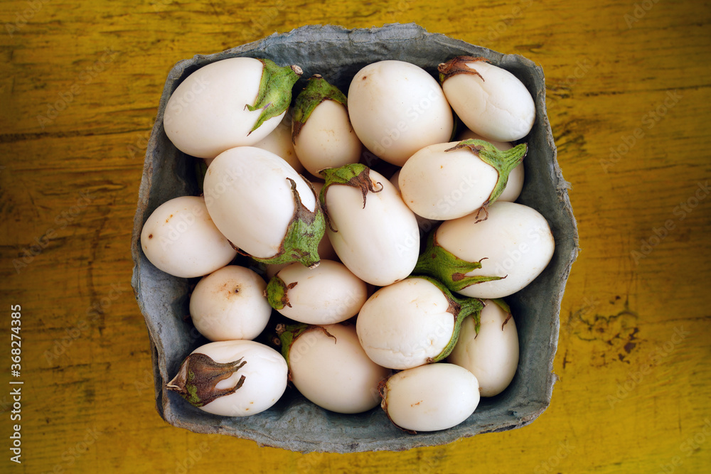 Container of white baby eggplants Container of white baby eggplants