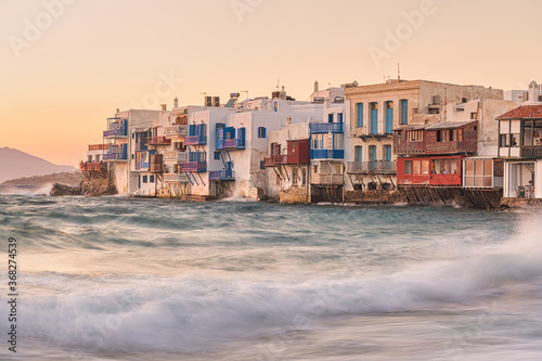 Little Venice and traditional Greek architecture in Mykonos Island, Greece at sunset. Travel and tourism concept.