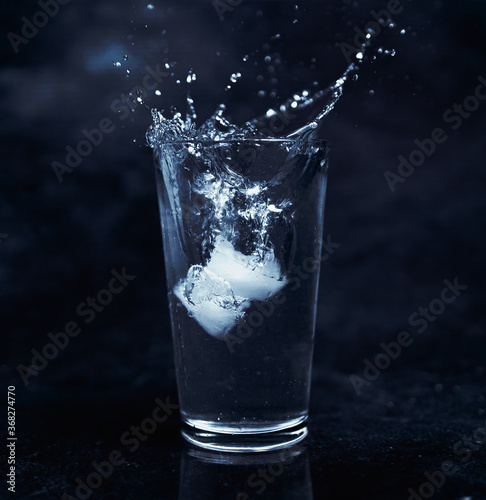 Ice on glass of water