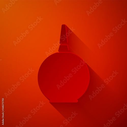 Paper cut Enema icon isolated on red background. Enema with a plastic tip. Medical pear. Paper art style. Vector Illustration.