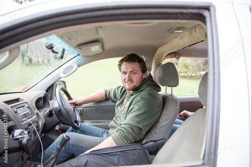 Young man in drivers seat of ute