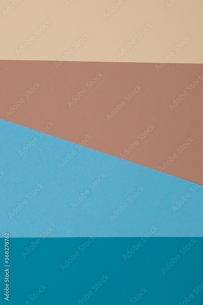 Fototapeta premium Blue, brown and yellow background, colored paper geometrically divides into zones, frame, copy, space.