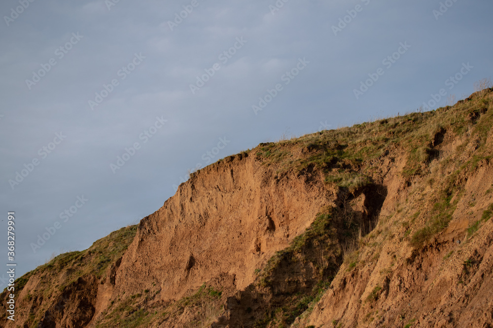 Beach cliffs with blue sky