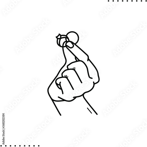 hand holds two rings, engagement or wedding vector icon in outlines