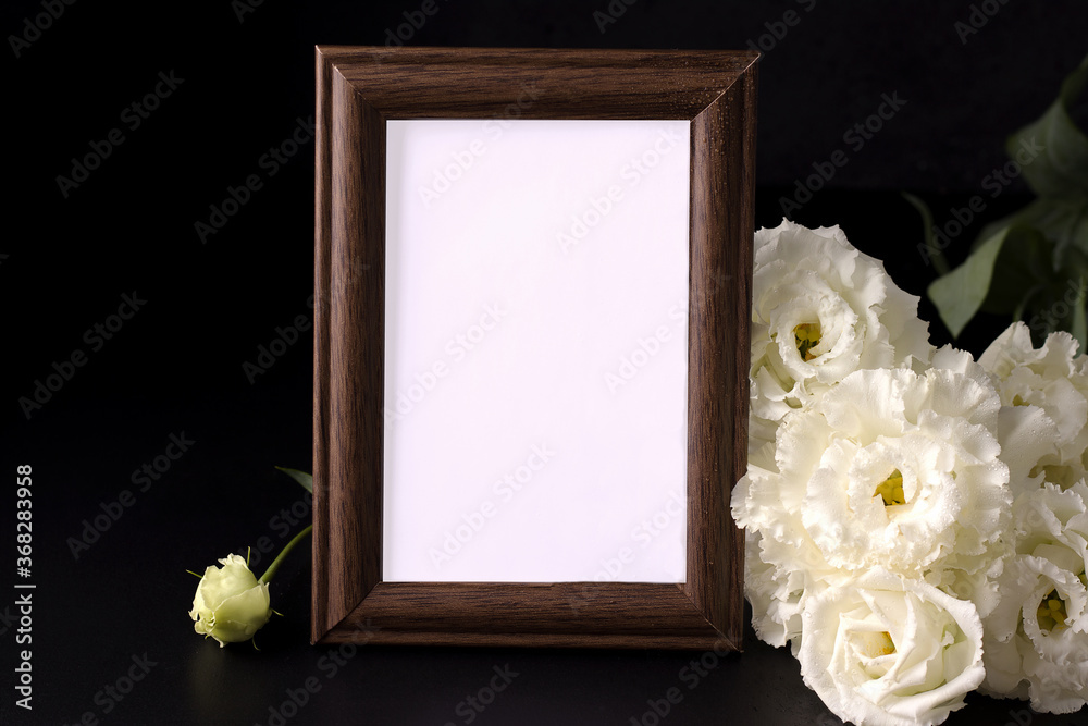 mockup of empty mourning frame next to white flowers. death and sorrow  concept Stock Photo | Adobe Stock