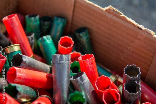 Empty shotgun shells from trap shooting, skeet, or sporting clays.