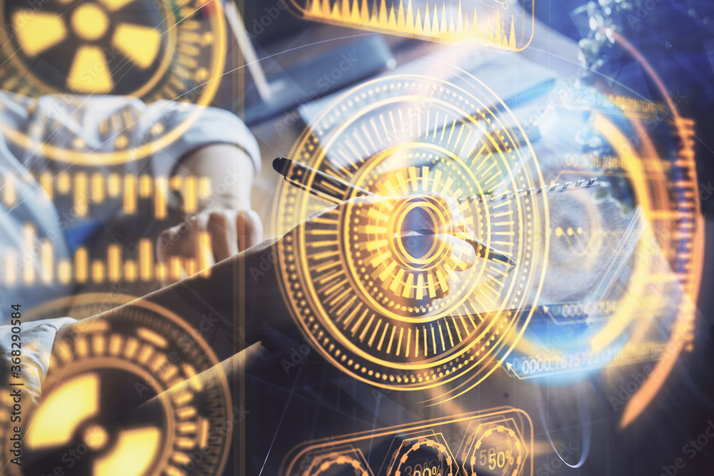Fototapeta premium Tech theme hologram over woman's hands taking notes background. Concept of hightech. Double exposure