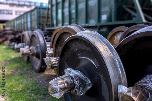 New railway wheelsets are stored in the car repair depot photo