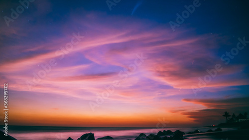 Fototapeta Naklejka Na Ścianę i Meble -  Breathtaking of the Neowise Comet and the sunset over the beach