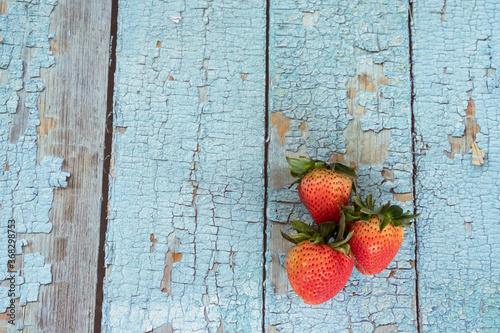 Top view strawbarry on table,real berry on backdrop.