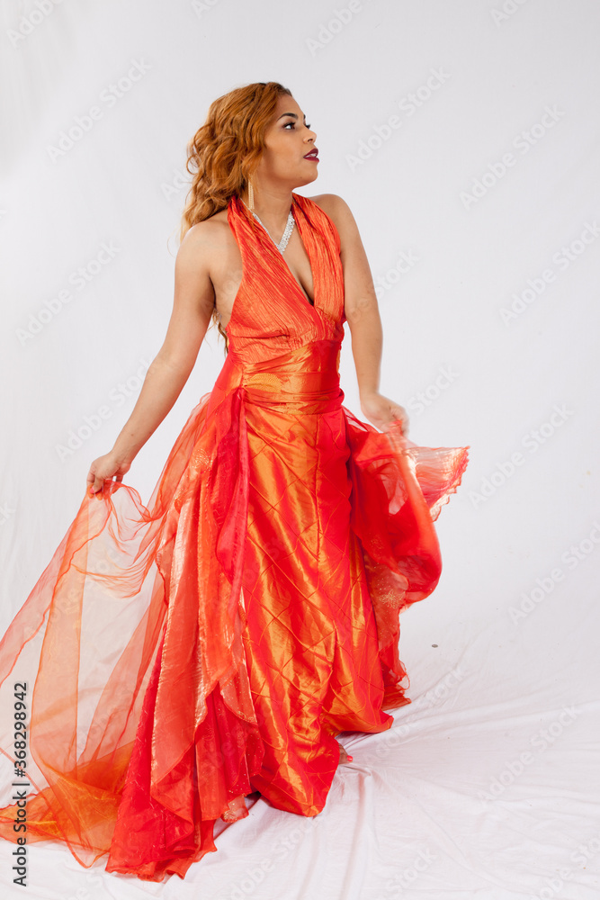 Lovely Hispanic woman playing with her dress Lovely Hispanic woman playing with her dress