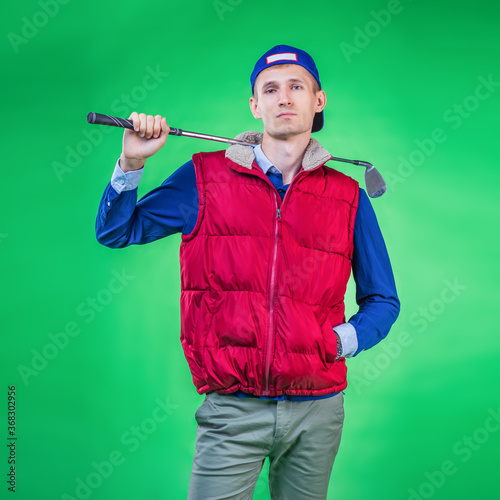 A guy playing golf in sportswear is standing in a relaxed position, square image